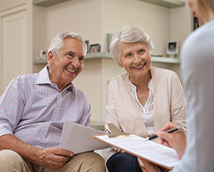 A doctor talking to a couple. Links to Donor-Advised Funds A doctor talking to a couple. Links to Donor-Advised Funds