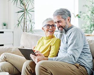 Photo of a couple on a couch. Link to Gifts That Pay You Income. Photo of a couple on a couch. Link to Gifts That Pay You Income.